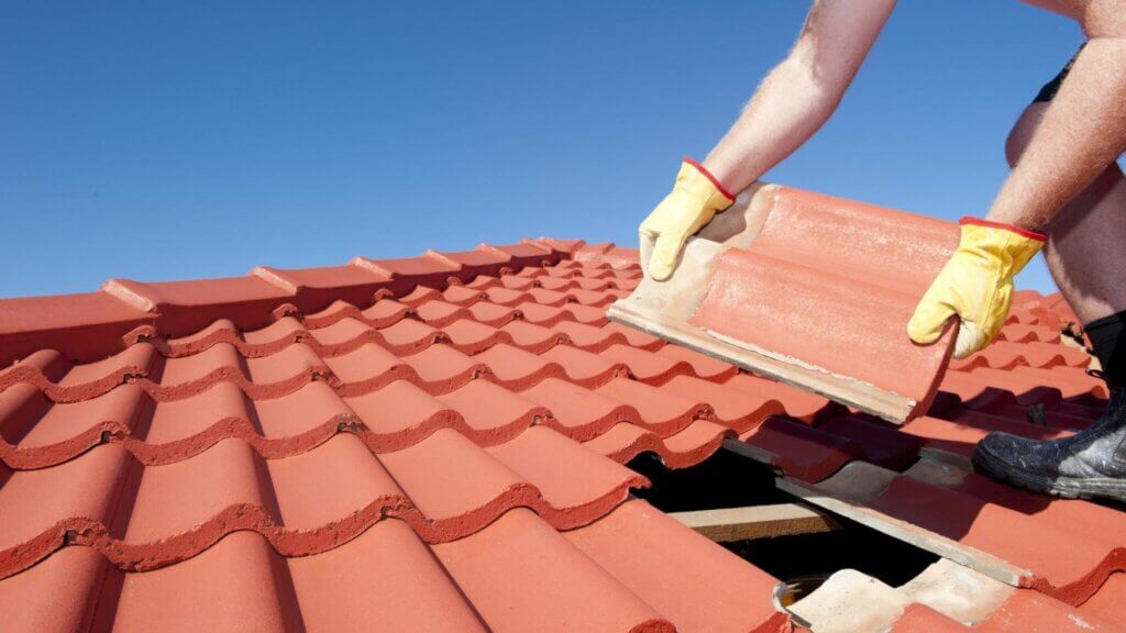 person doing a roofing installation