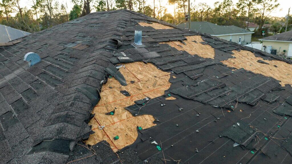 black roof damaged after a storm.