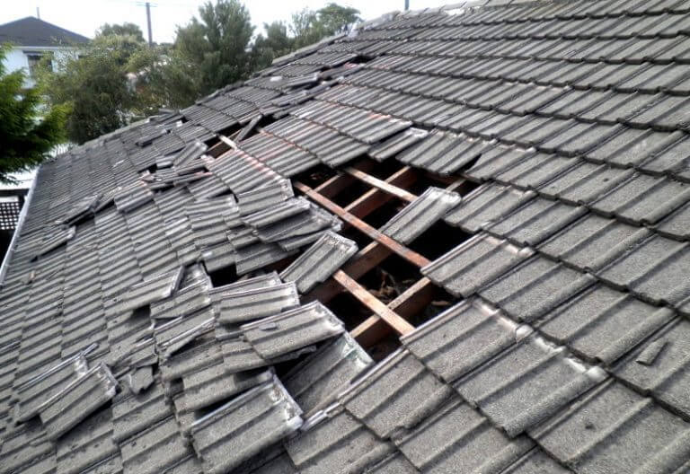 Black roof, damaged by the weather.